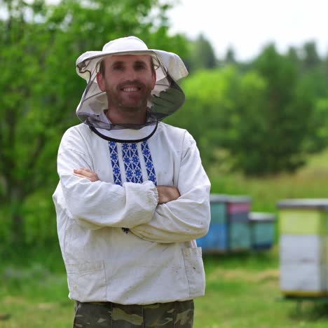 male beekeeper in protective clothing
