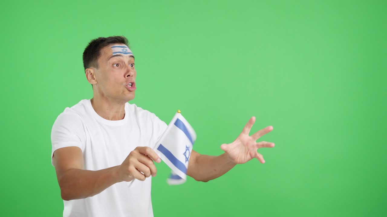 Man cheering for Israel waving a national flag looking away