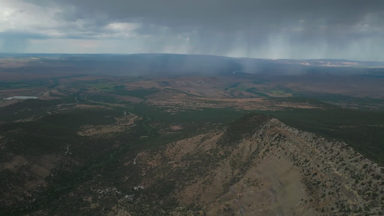 Raining Lands End Hill Climb Grand Mesa Grand Junction Colorado aerial drone summer morning clouds thunderstorm rain sunny Western Slopes Delta Montrose Olathe shade dark forward pan up motion