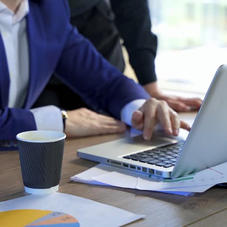 man typing on laptop at office. businessman working on laptop at home office