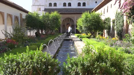 fountain in slow motion inside the alhambra of granada, spain