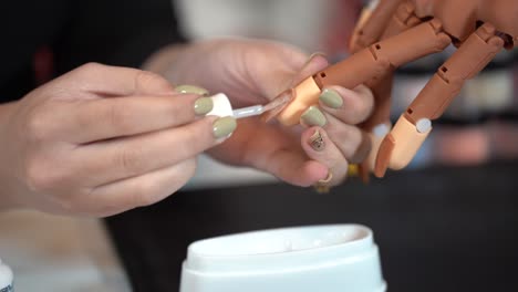 teaching how to manicure on industrialist hand