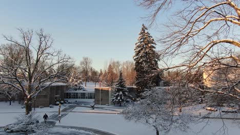 rising shot from linden hall grounds to reveal surrounding snow covered lititz neighborhood in early morning