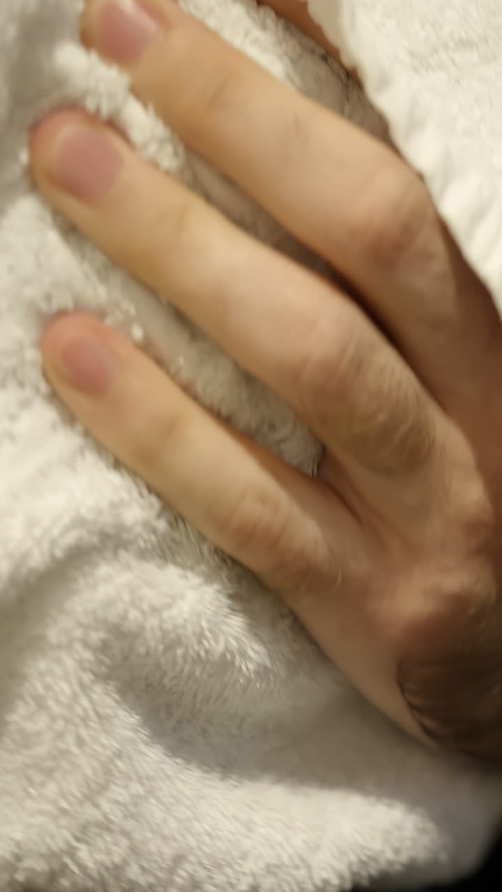 Person using towel and wearing a watch