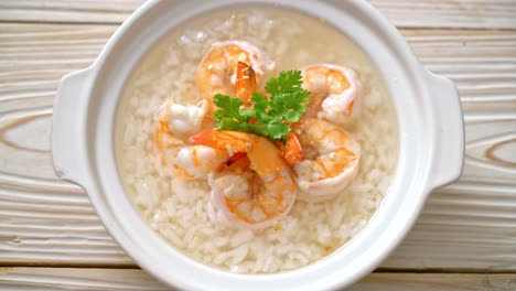 porridge or boiled rice soup with shrimps bowl