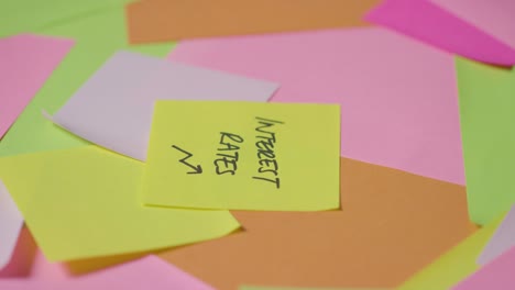 business concept of revolving sticky notes with interest rates written on top note 1