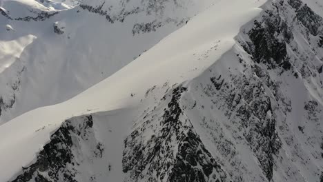 dramatic aerial view of mt currie snowy ridge in the winter