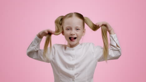 happy little girl with double ponytails