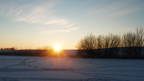 bright cinematic winter sunset illuminate snowy frozen lake and parked car