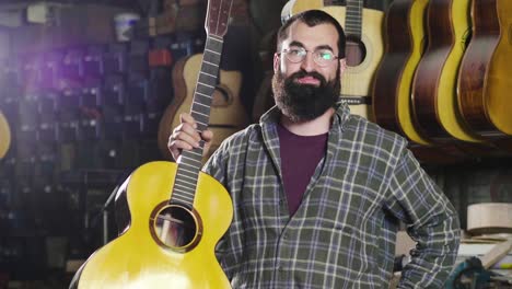 in his laboratory, a liutist builds high quality guitars for musicians, working fine wood.