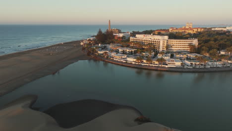 morning wonders over maspalomas: aerial view of gran canaria's dunes and lighthouse