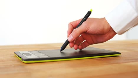 hand of graphic designer using graphic tablet