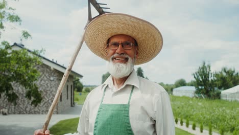 smiling gardener with rake