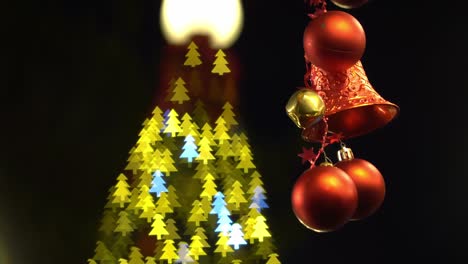 Ornament-christmas-hand-with-bokeh-christmas-tree.