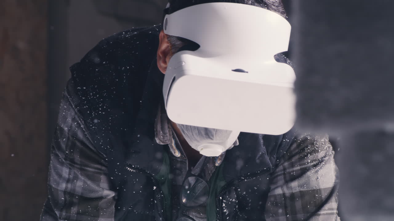Man wearing VR headset in a snowy workshop