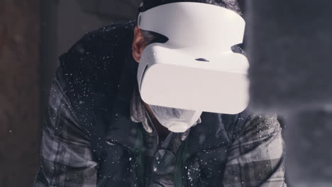 man wearing vr headset in a snowy workshop