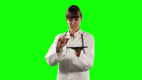 Front-view-of-female-doctor-using-a-digital-tablet-with-green-screen