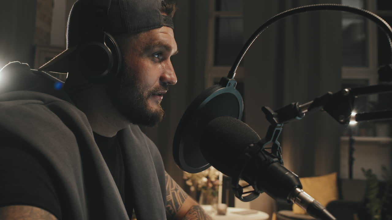 Man in Headphones Recording Podcast at Home