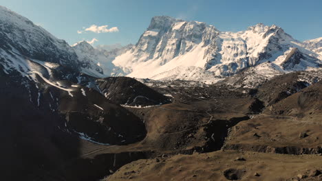 aerial shot closing on snowy mountains in a crispy day at cordillera de los andes, chile-4k