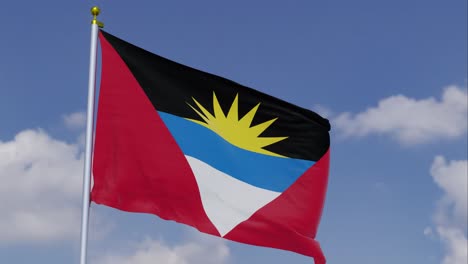 flag of antigua and barbuda moving in the wind with a clear blue sky in the background, clouds slowly moving, flagpole, slow motion