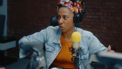 woman radio host in podcast studio