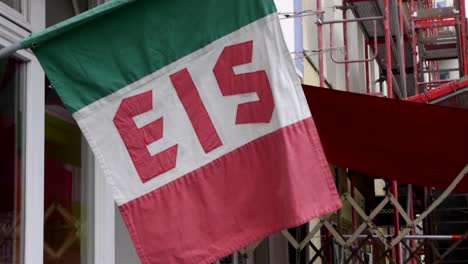 Close-up-shot-of-Italian-flag,-indicating-place-where-sells-ice-cream-or-Gelato,-in-Berlin,-Germany