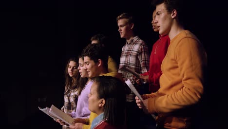 teenagers rehearsing in a theatre