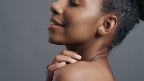 close-up-portrait-beautiful-african-american-woman-touching-face-with-hands-caressing-bare-shoulders-enjoying-smooth-healthy-skin-complexion-perfect-natural-beauty-on-grey-background