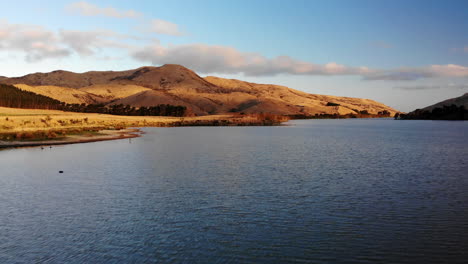 Lake-and-mountains-during-sunset-sunrise-4k-drone-New-Zealand