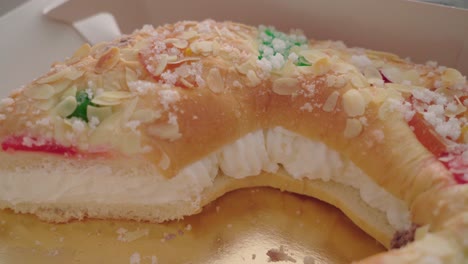 typical spanish christmas pastry with cream filling and candied fruit