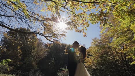 Groom-with-bride-in-the-forest-park.-Wedding-couple.-Happy-family