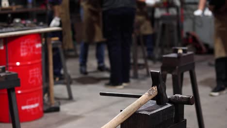 Metal-tools-on-anvil-in-blacksmith-workshop