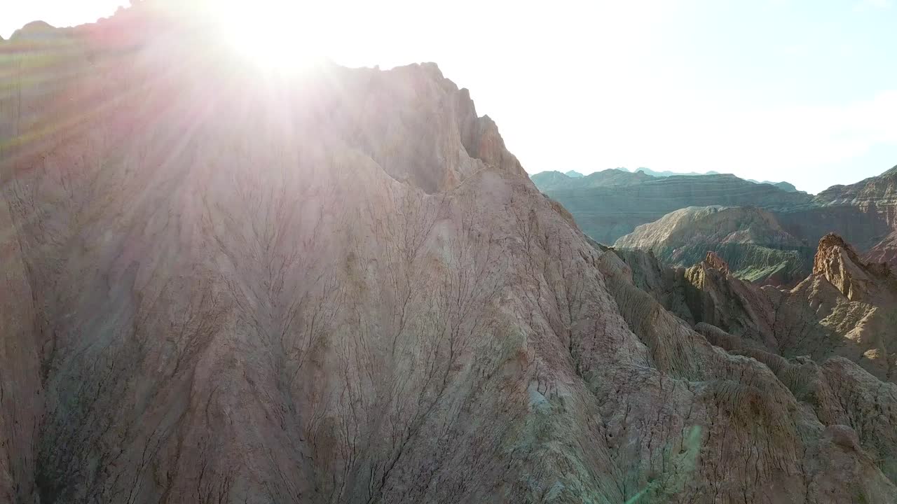 Drone Aerial View of Sunlight Backlight Over Sandstone Cliffs in Calchaqui Valley, Salta, Argentina