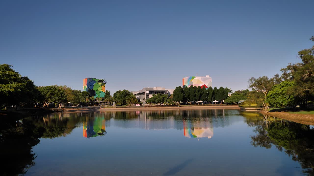 Wide view of HOTA across the Home of the Arts Lake on a sunny day, Gold Coast, Queensland, Australia