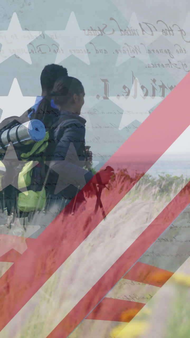 animación de la bandera estadounidense sobre una pareja diversa caminando en las montañas