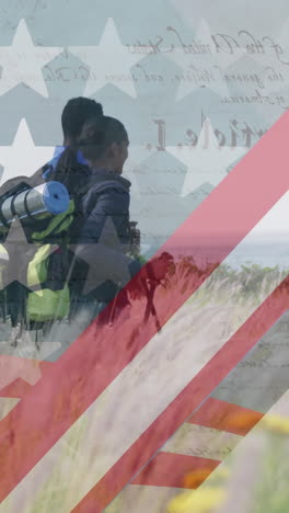 animation of american flag over diverse couple hiking in mountains