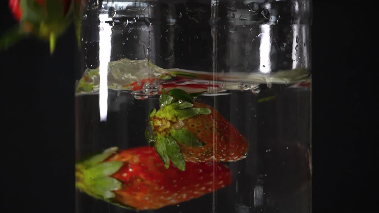 Strawberry fruit under water cleaning washing display, fresh crispy commercial