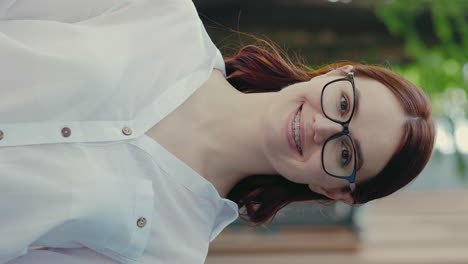 smiling woman with glasses and braces