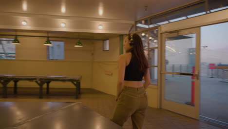 young, female, contemporary dancer in urban market after hours