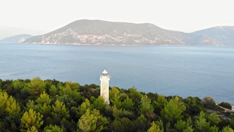 fiskardo lighthouse and pristine blue water of ionian sea at kefalonia island in greece