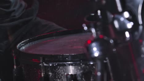 drummer playing a wet drum set