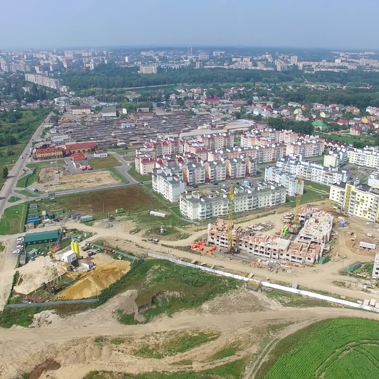 construction of a modern district with high-rise buildings for people. Camera motion around. Landscape of city in aerial view