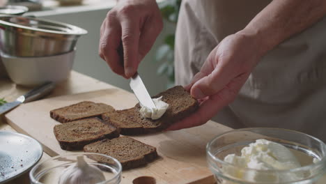 preparing toasted bread with cream cheese