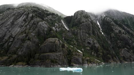 sparkling still waters, majestic mountains with sheer granite cliffs, waterfalls and impressive icebergs at endicott arm fjord, alaska.