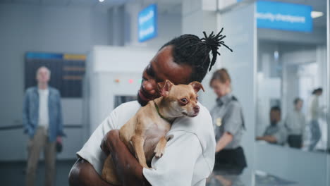 man with dog at airport security