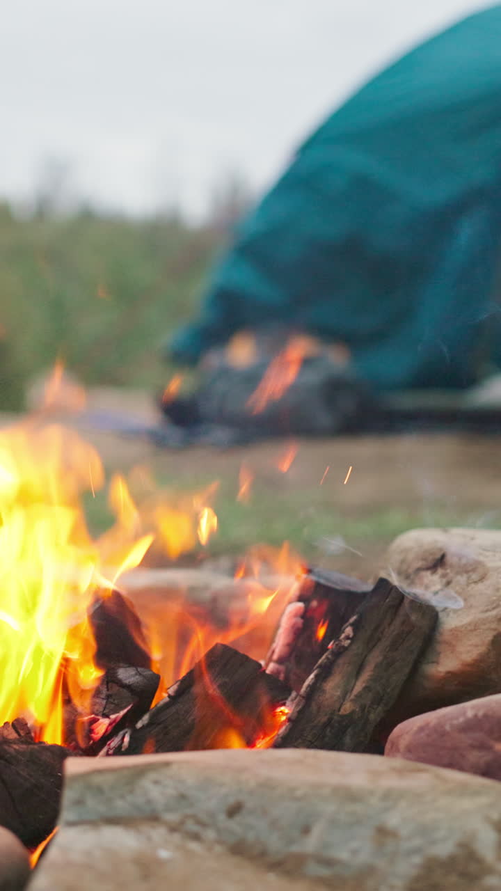 Campfire near a Tent