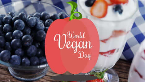 animación del texto del día vegano mundial sobre fruta fresca