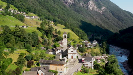 revealing drone shot of lavertezzo switzerland starting on the madonna degli angeli