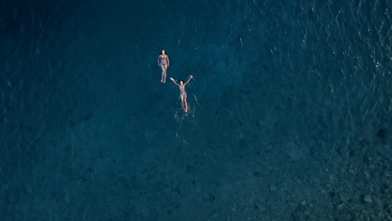 Two Women Floating in the Ocean