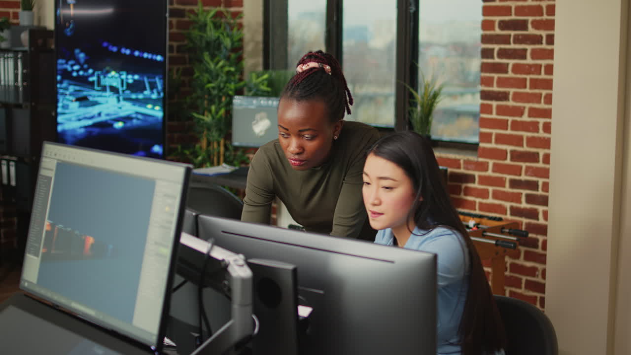 Artistic creators analyzing graphics industry software on computer